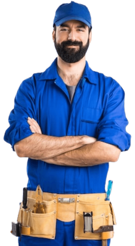 A man with a beard wearing a blue cap and coveralls stands with arms crossed, smiling. He has a tan tool belt around his waist holding various tools.